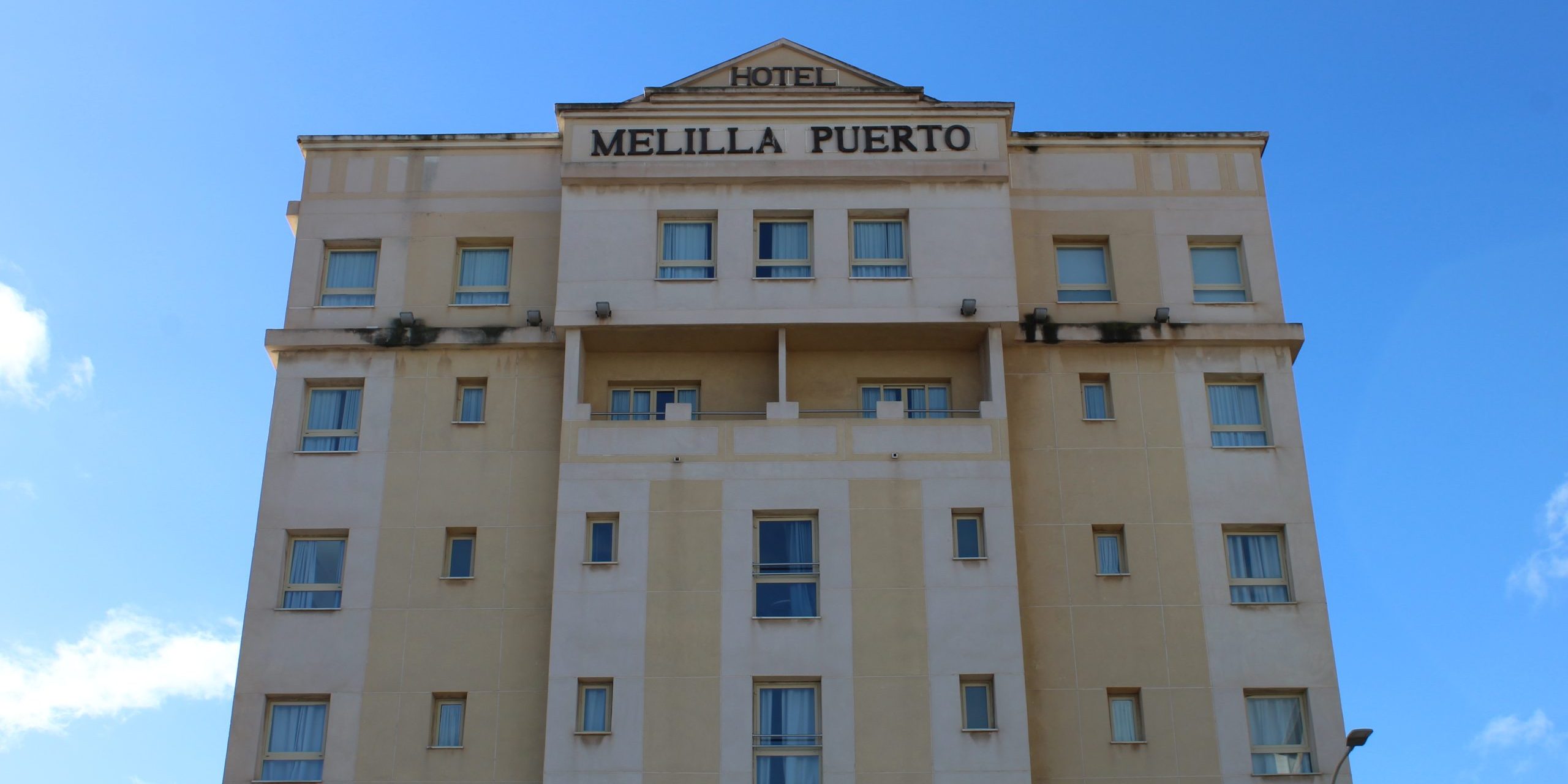 Hotel Melilla Puerto building tower backed by blue sky