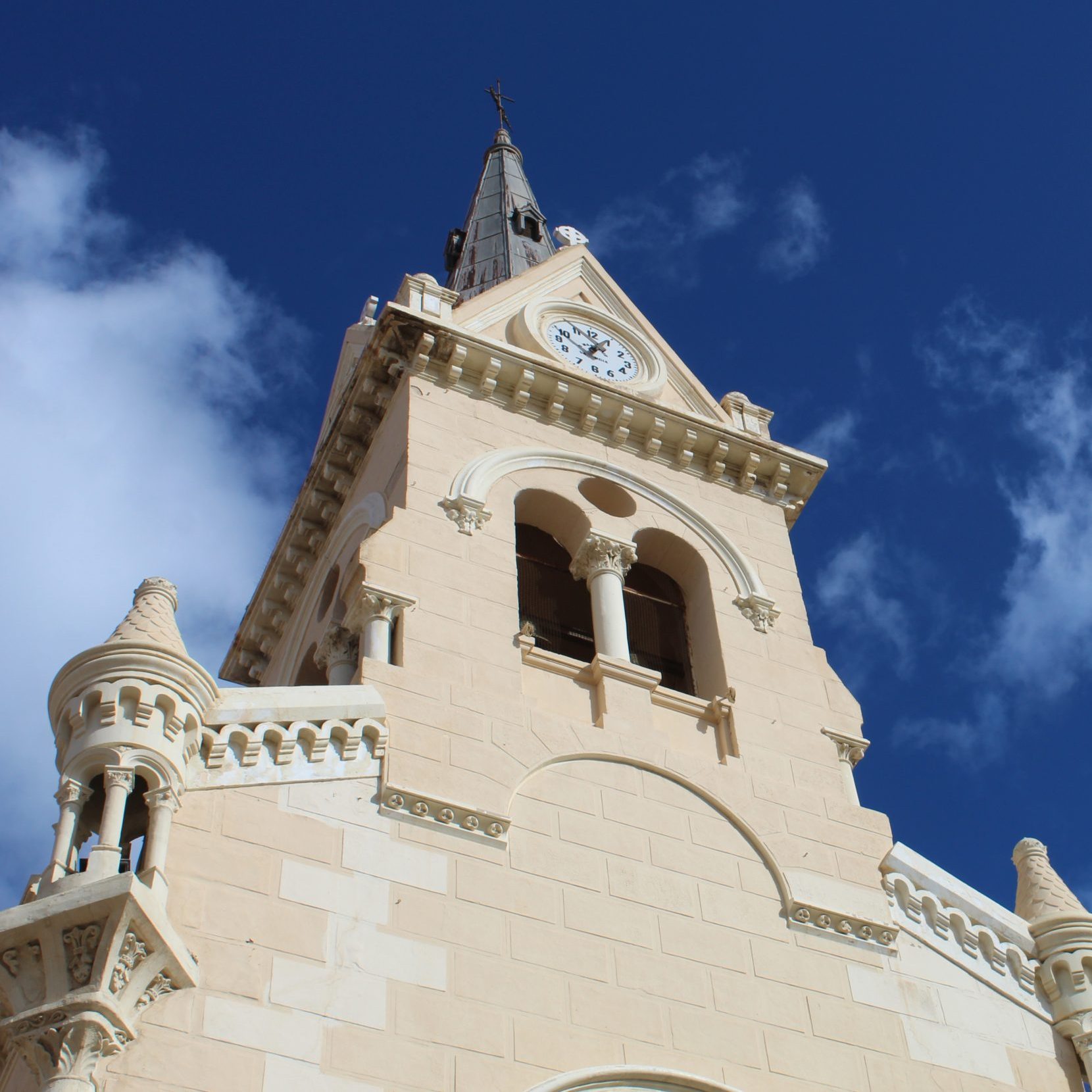 Melilla's Iglesia del Sagrado Corazon with its neo-Romanesque tower brightly lit by the North African sun