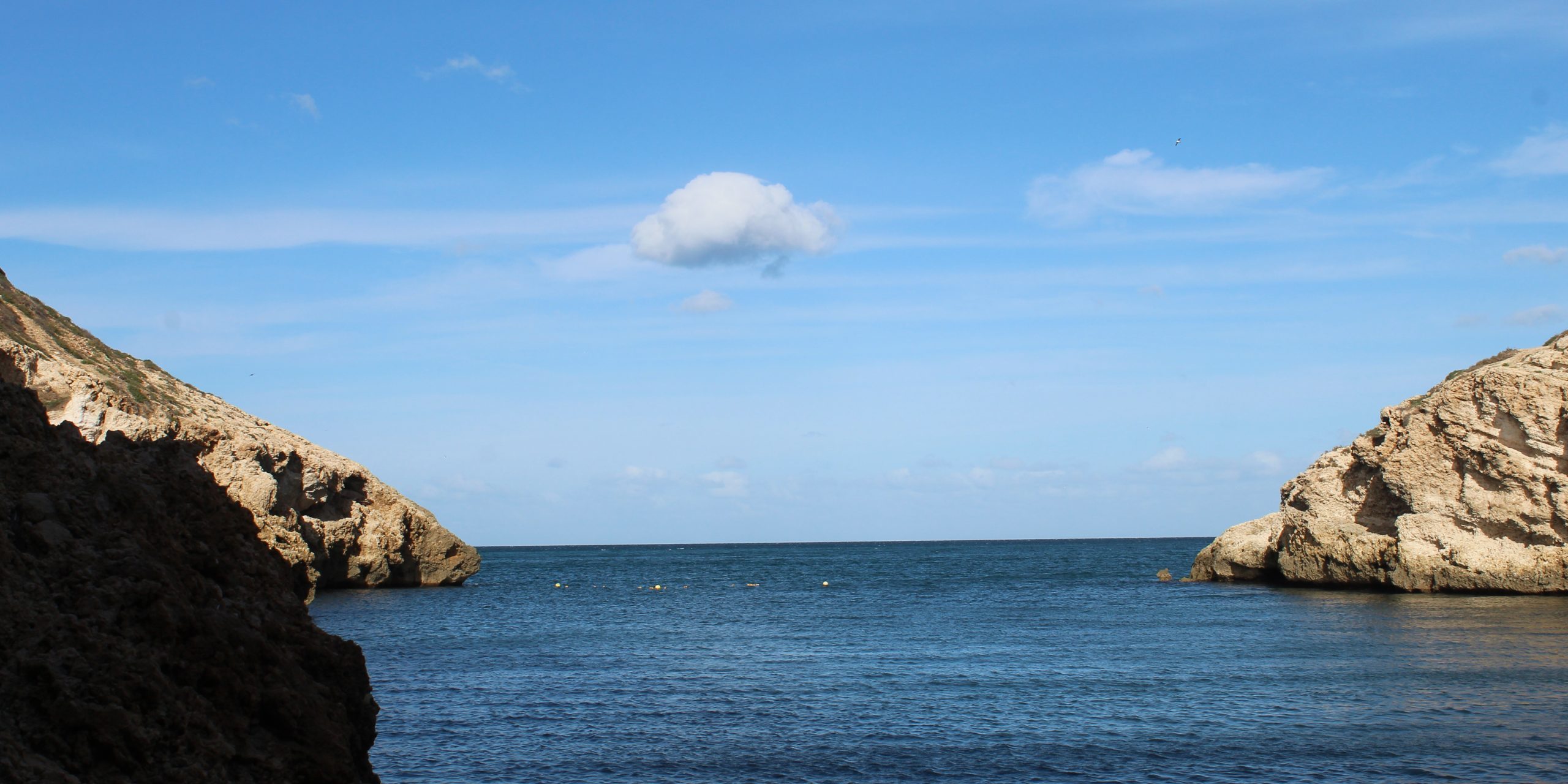 Blue skies over blue waters of the Mediterranean sea viewed from Melilla