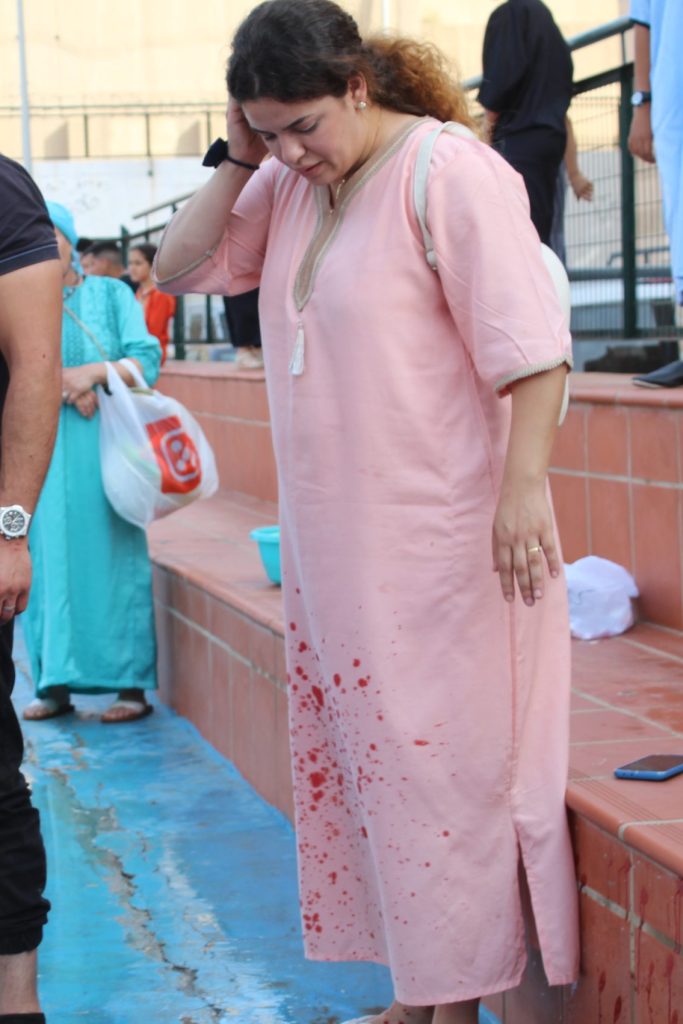 Woman in North African Islamic dress and expression of disgust at Eid al-Adha activities
